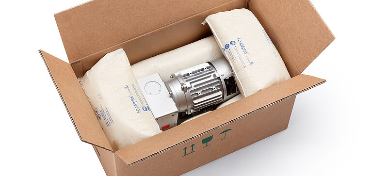 
		  A cardboard box containing an engine component and foam packaging