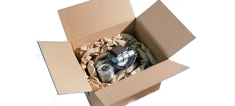 
		  A cardboard box containing a component and brown paper cushioning