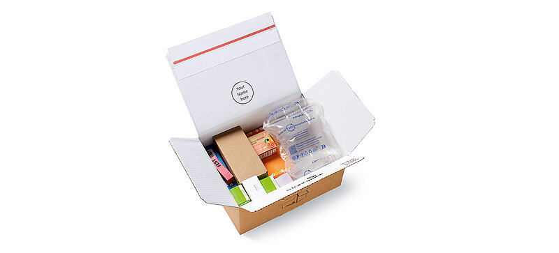 Open cardboard box with protective air cushions