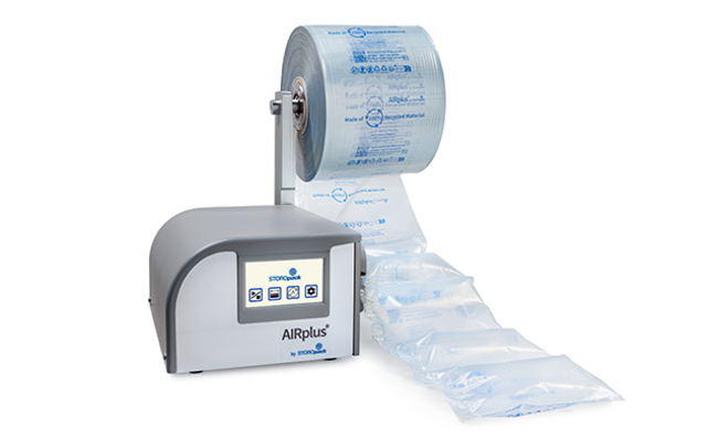 A grey machine filling air cushion film with air 