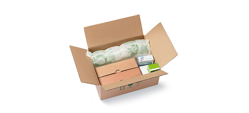 Open cardboard box with protective air cushions