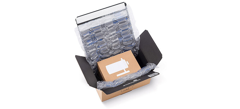 Sichere Versandverpackung für den E-Commerce mit Schutzpolsterung und Luftpolsterfolie.