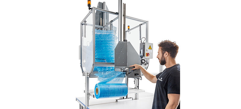 Man operating an air cushion machine