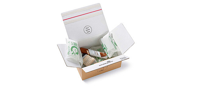 
			Open cardboard box with protective air cushions